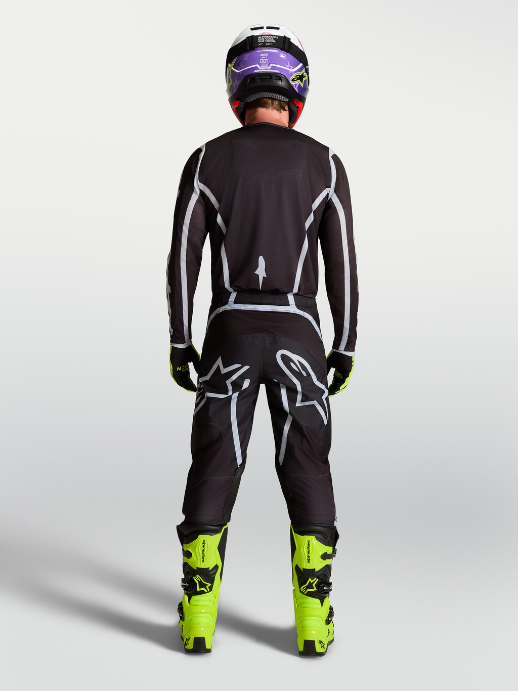 Alpinestars Fluid Apex V2 broek, heren motorcrossbroek, zwart en zilver, achteraanzicht met ergonomische sportpasvorm.