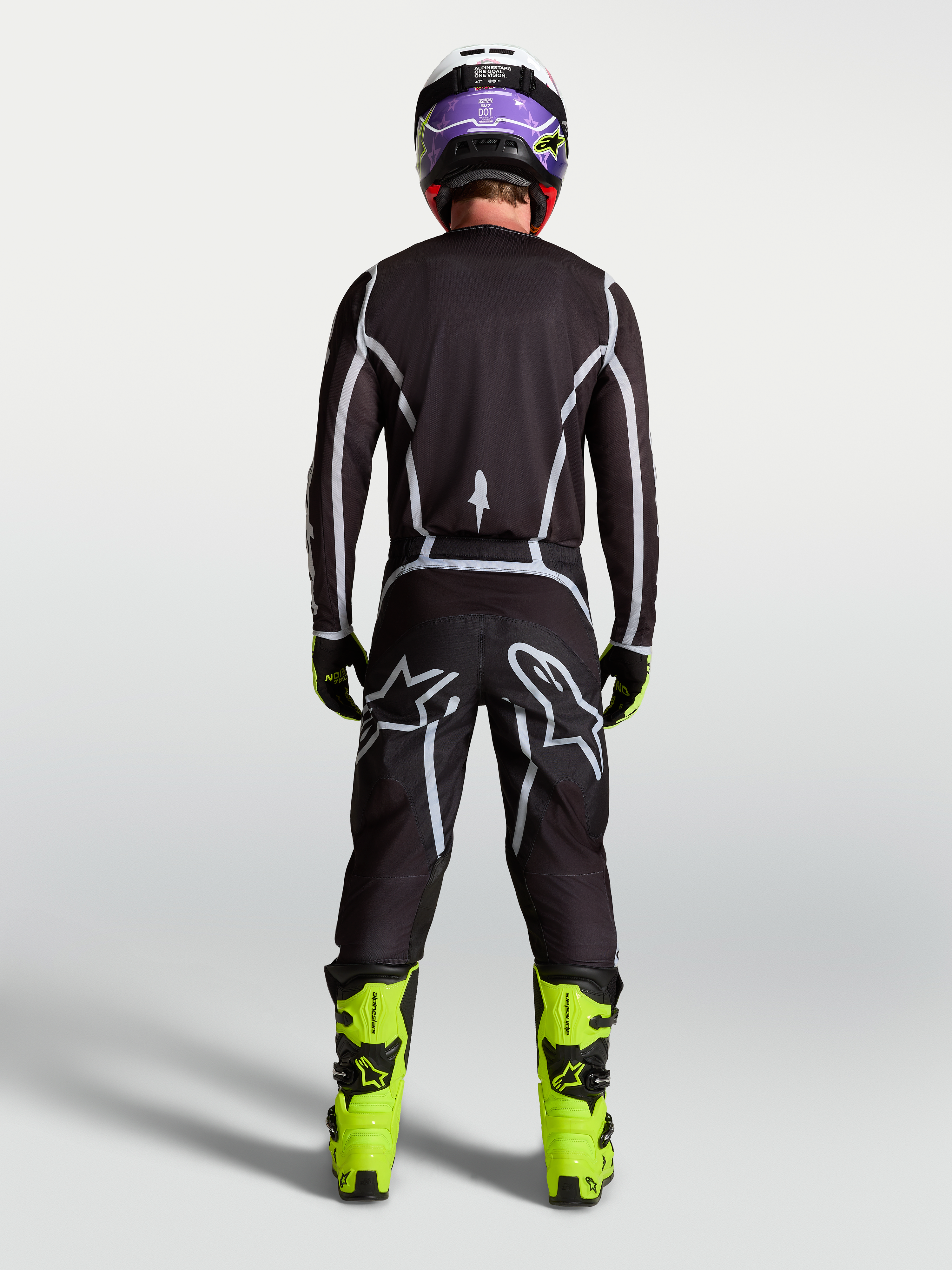 Alpinestars Fluid Apex V2 broek, heren motorcrossbroek, zwart en zilver, achteraanzicht met ergonomische sportpasvorm.