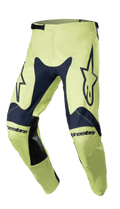 Alpinestars 2023 Racer Hoen Pants, Motocross Racing Pants, Night Navy and Fluorite Green, featuring large star logos on thighs, black leather inner-leg patches, pre-curved ergonomic construction, and adjustable ratchet waist closure.
