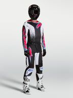 Alpinestars Fluid Drag broek, herenmotocross-uitrusting in zwart en wit met fluorode accenten.