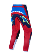 Alpinestars Fluid Drag broek, motocrossbroek voor heren, donkerblauw en felrood met witte en gele accenten, achteraanzicht.