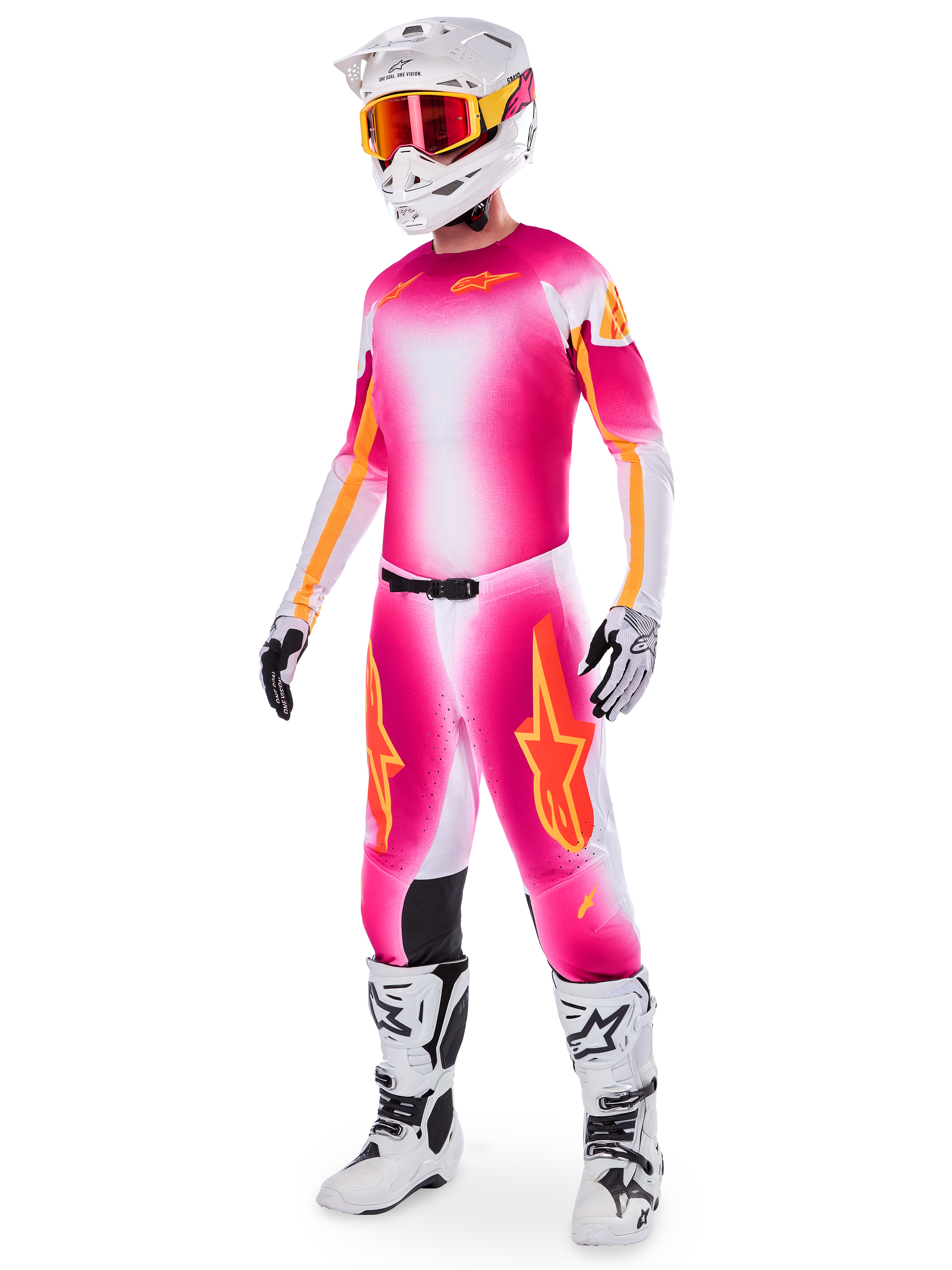 Motocross-Fahrer im Alpinestars Supertech AFD MIG Limited Edition Gear-Set, Trikot und Hose mit Farbverlauf in Pink Fluo, Weiß und Orange, weißer Helm mit orangefarbener Brille, weiß-schwarze Stiefel, professionelle Motocross-Bekleidung