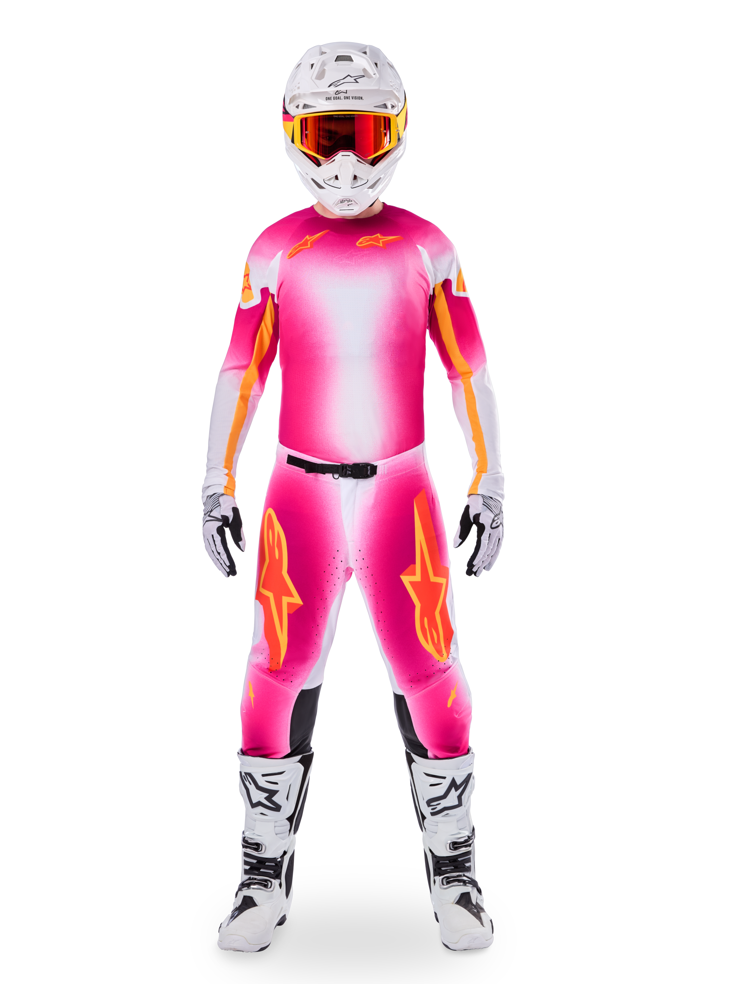 Motocross-Fahrer im Alpinestars Limited Edition Supertech AFD MIG Gear Set, Jersey und Hose mit leuchtendem Pink-Fluo-Weiß-Farbverlauf und orangefarbenen Logos, weißer Helm mit roter Brille, weiß-schwarze Stiefel und Handschuhe, abgestimmtes professionelles Rennoutfit.