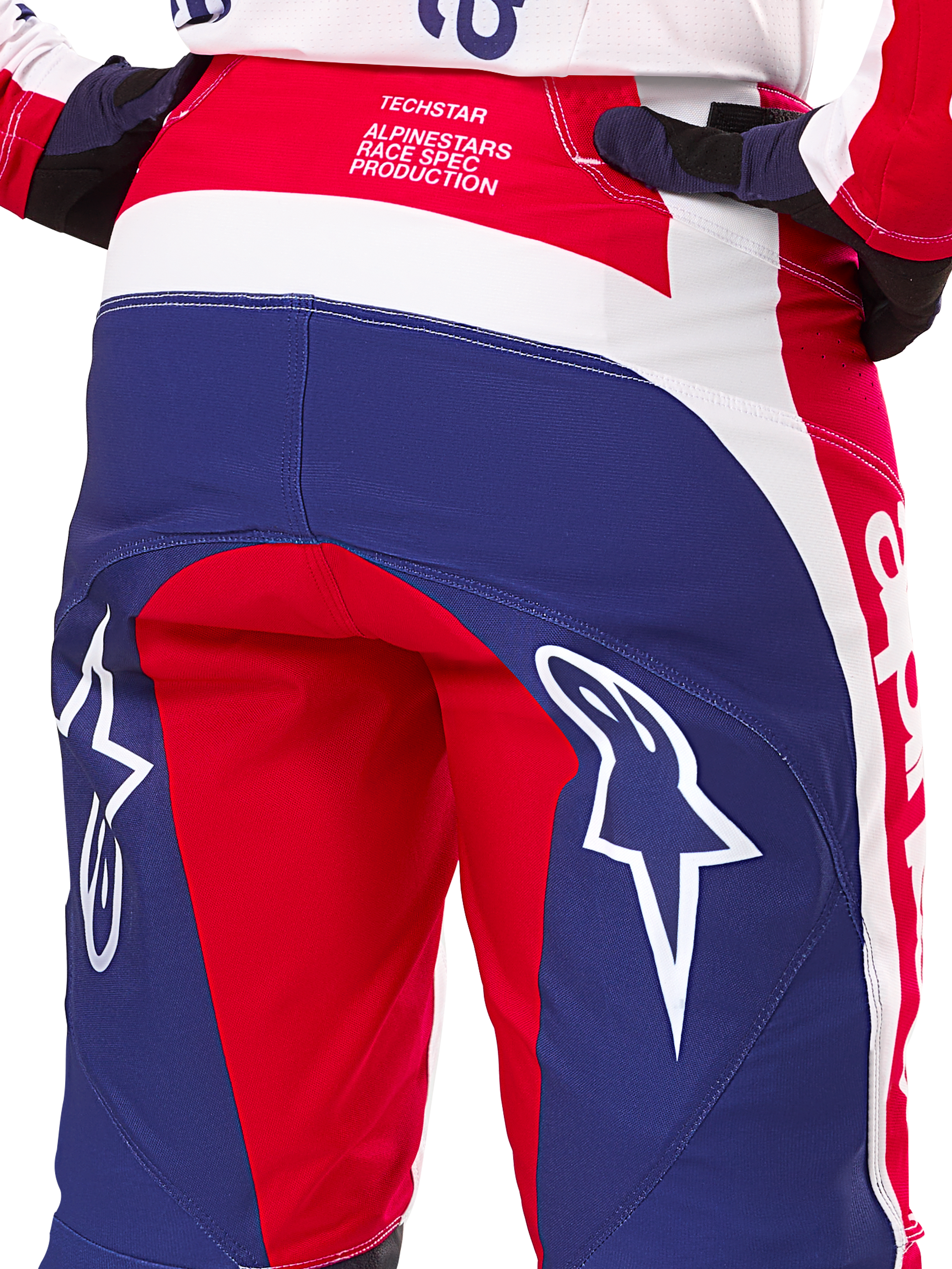 Alpinestars Limited Edition Techstar Fortitude Hose, Motocross-Hose, Rot, Weiß und Blau, Rückansicht mit großen weißen Stern-Logos auf dem Gesäß und Techstar Race Spec-Branding, strapazierfähige Performance-Textilien für Offroad-Rennsport