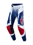 Alpinestars Techstar Unity, pantalon de motocross édition limitée pour homme, bleu et blanc avec motifs d'étoiles rouges.