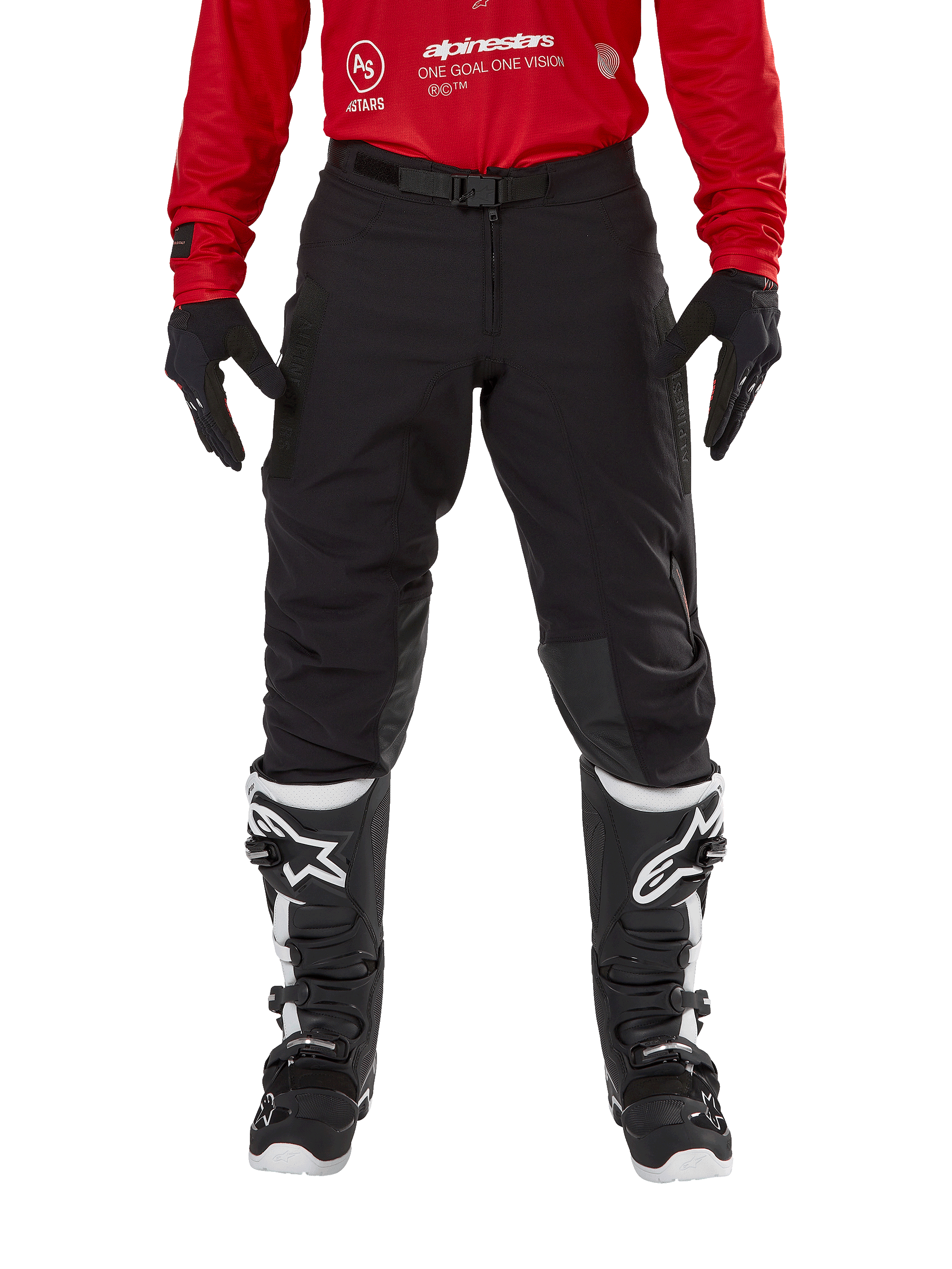 Alpinestars Techdura Pants, Enduro and Off-Road Pants, Black, worn with a red Alpinestars jersey and black and white boots, featuring rugged stretch canvas construction, adjustable magnetic belt buckle, and leather knee reinforcements for off-road performance.
