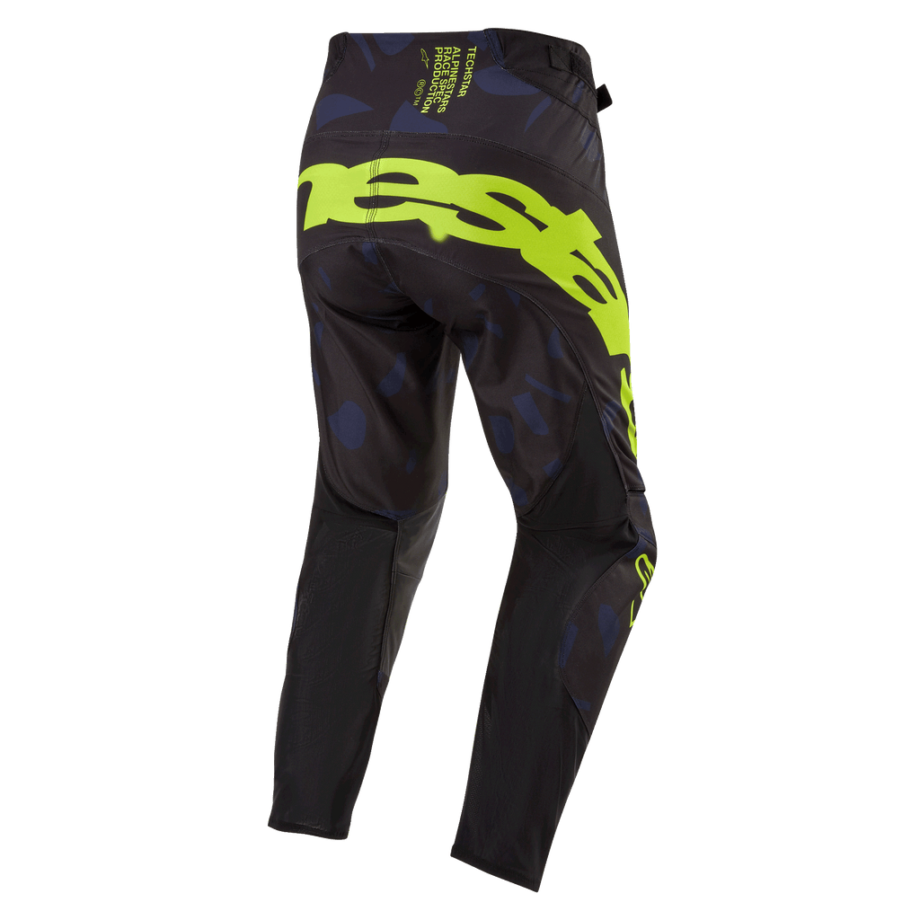 Alpinestars Techstar Rantera 2024, pantalon de motocross, noir, bleu marine et jaune fluo, vue arrière présentant un marquage jaune fluo audacieux sur l'assise, des empiècements à motifs bleu marine et un tissu technique noir pour la performance en course tout-terrain