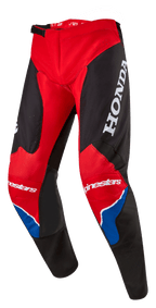 Alpinestars Honda Racer Iconic crossbroek, motorcrossbroek, felrood, zwart en wit met blauwe accenten, voorzien van een groot wit HONDA-logo op de dij, Alpinestars-branding op de knieën, ergonomische voorgevormde beenconstructie en verstelbare ratelsluiting in de taille.