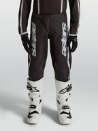 Alpinestars Jeugd Fluid Apex V2 broek, motocrossbroek voor kinderen, zwart en zilver, duurzame 600D-polystof.