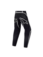 Alpinestars Jeugd Fluid Apex V2 broek, motorcrossbroek in zwart en zilver, achteraanzicht met ergonomische constructie.