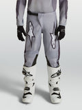 Alpinestars Pantalon Fluid Amber Junior, pantalon de motocross gris et noir pour enfant, en polyfibre 600D durable.