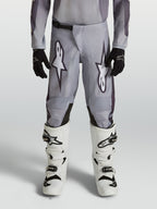 Alpinestars Pantalon Fluid Amber Junior, pantalon de motocross gris et noir pour enfant, en polyfibre 600D durable.