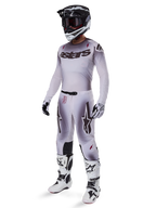 Alpinestars 2025 Supertech Maker Gear Set, complete motocross outfit, white and grey gradient with black branding and red accents, includes helmet with goggles, jersey, pants, white boots, and gloves, sleek performance-driven design for off-road racing