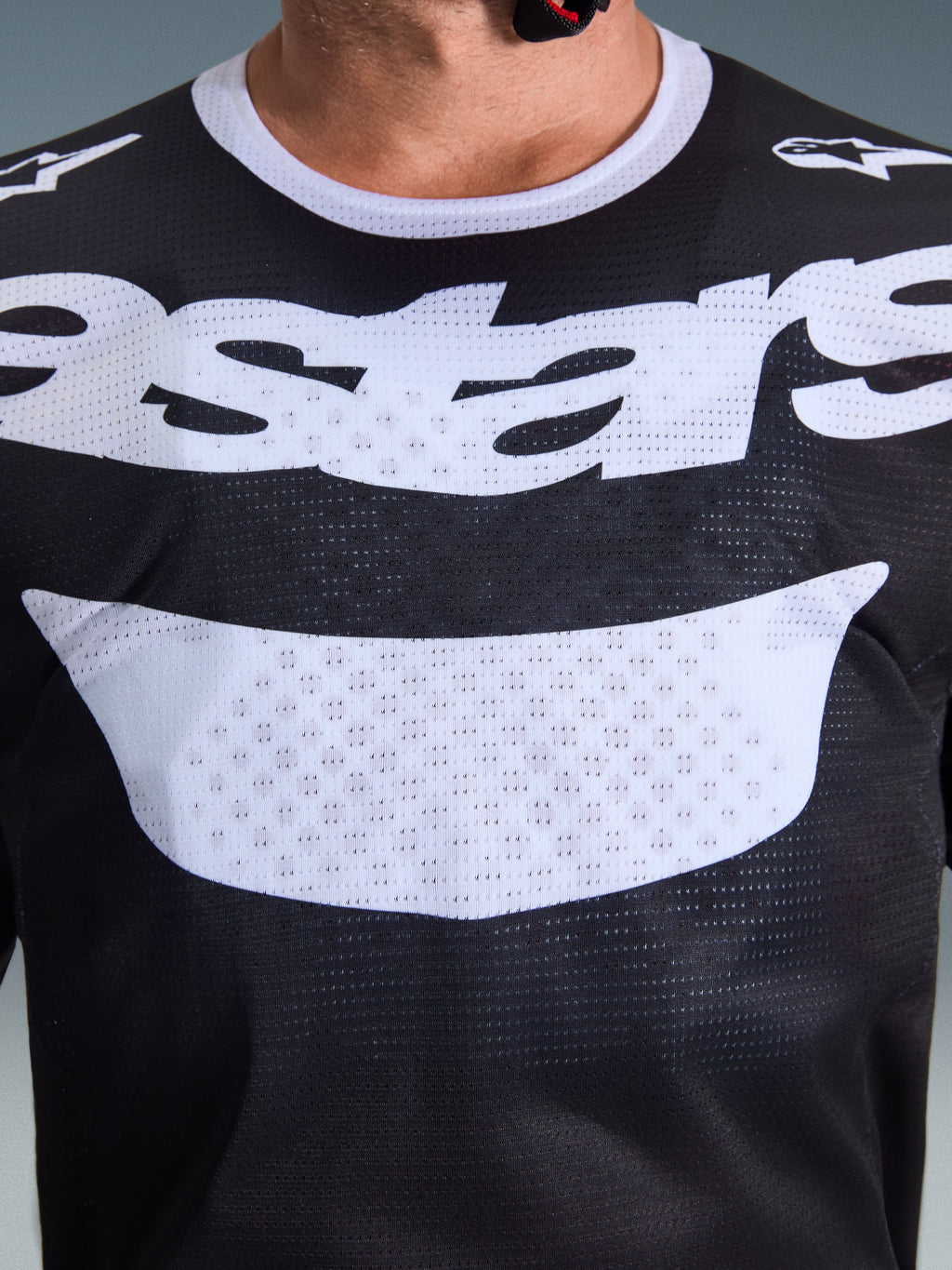 Alpinestars 2026 Racer Air Riway Jersey, Motocross Jersey, Black and White, close-up of chest showing large white graphic and breathable mesh construction, white collar and shoulder logos