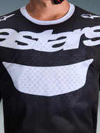 Alpinestars 2026 Racer Air Riway Jersey, Motocross Jersey, Black and White, close-up of chest showing large white graphic and breathable mesh construction, white collar and shoulder logos