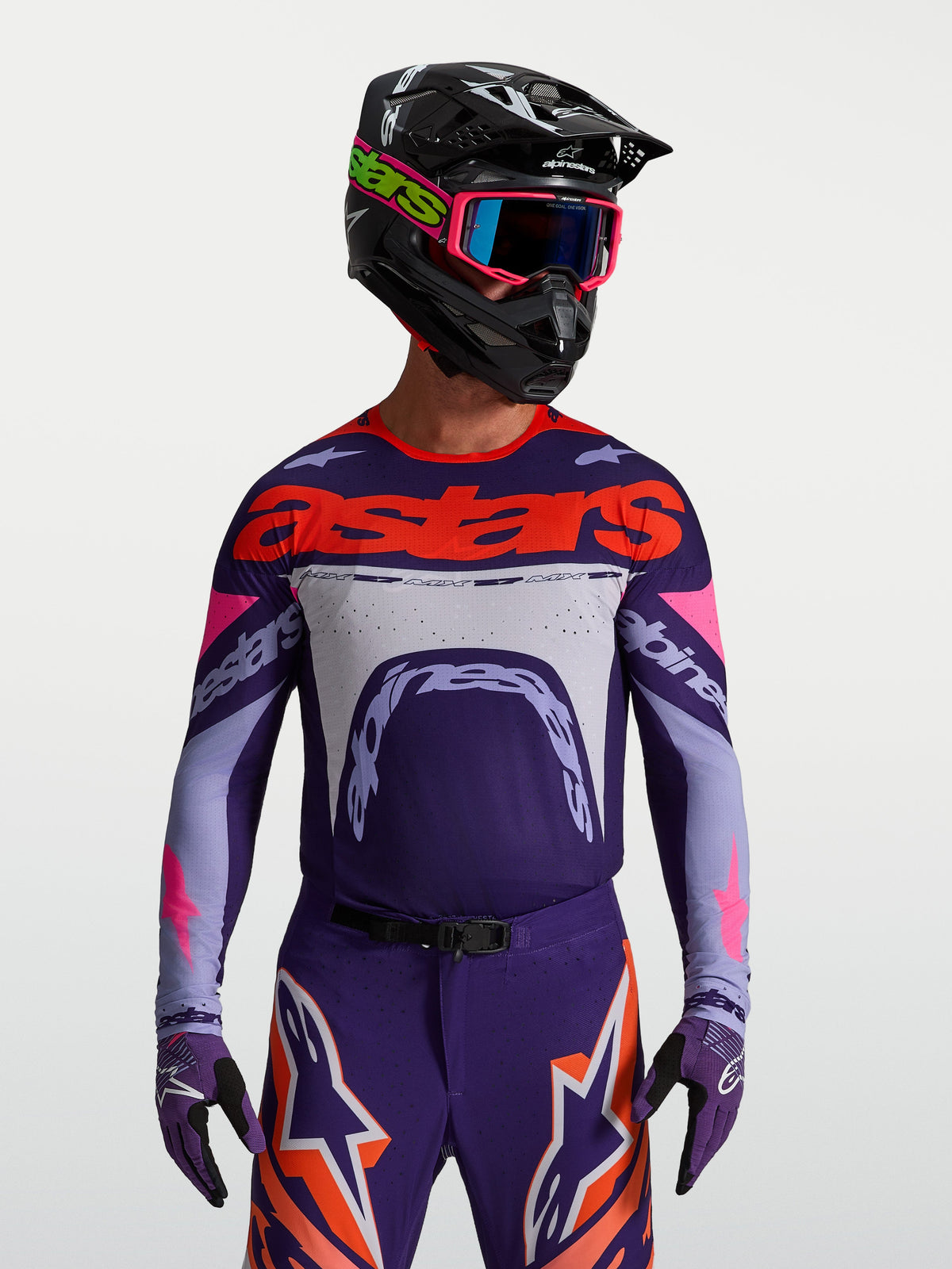 Alpinestars Maillot Supertech Dyna, maillot de motocross pour homme, violet et rose fluo, coupe athlétique en maille extensible avec perforations laser.