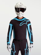 Alpinestars Supertech Vesta jersey, zwart en turquoise motocrossjersey voor heren met ademende lasergesneden ventilatie.