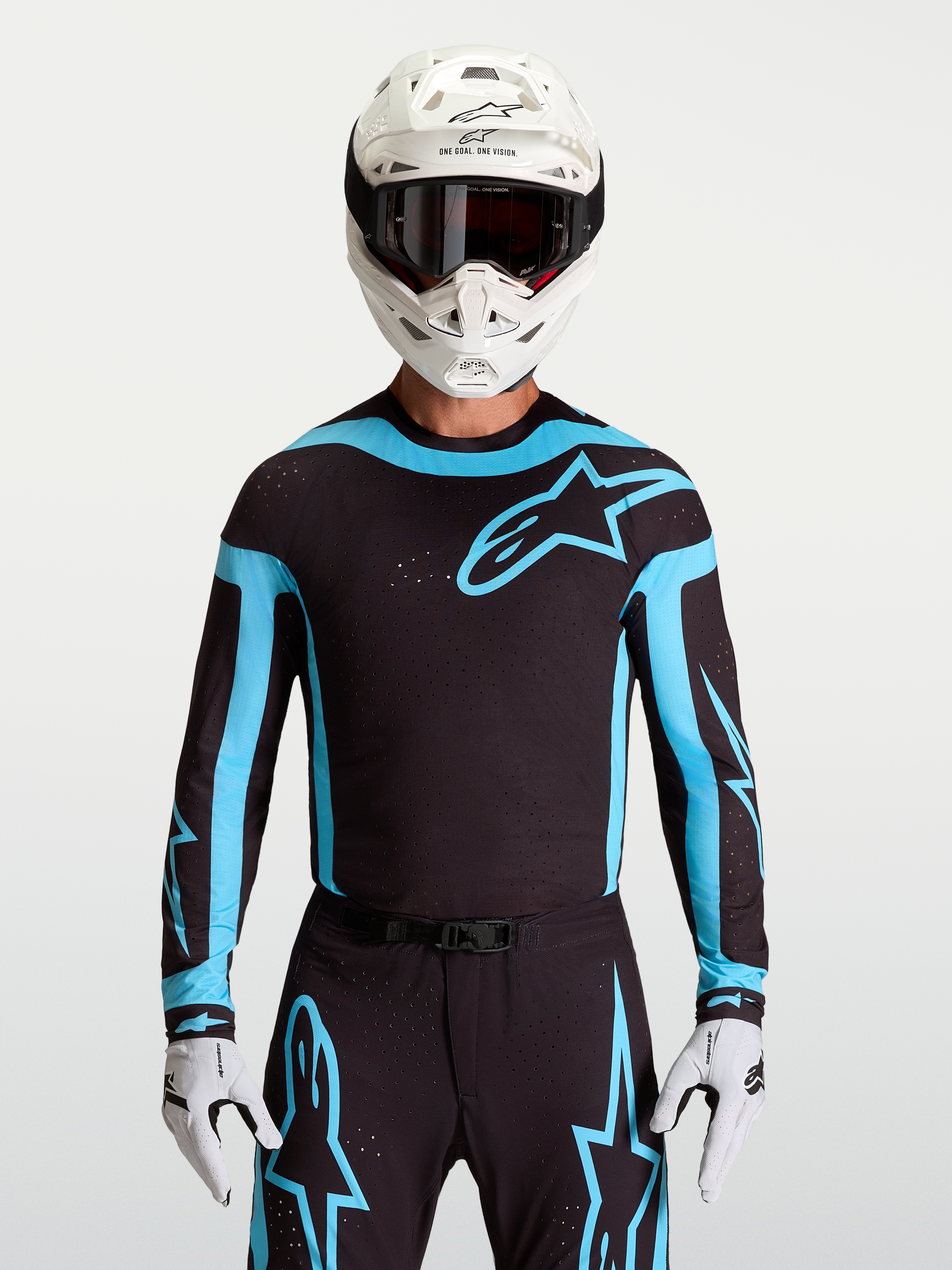 Alpinestars 2027 Supertech Vesta Jersey, men's black and turquoise motocross racing top with laser-cut stretch mesh panels.