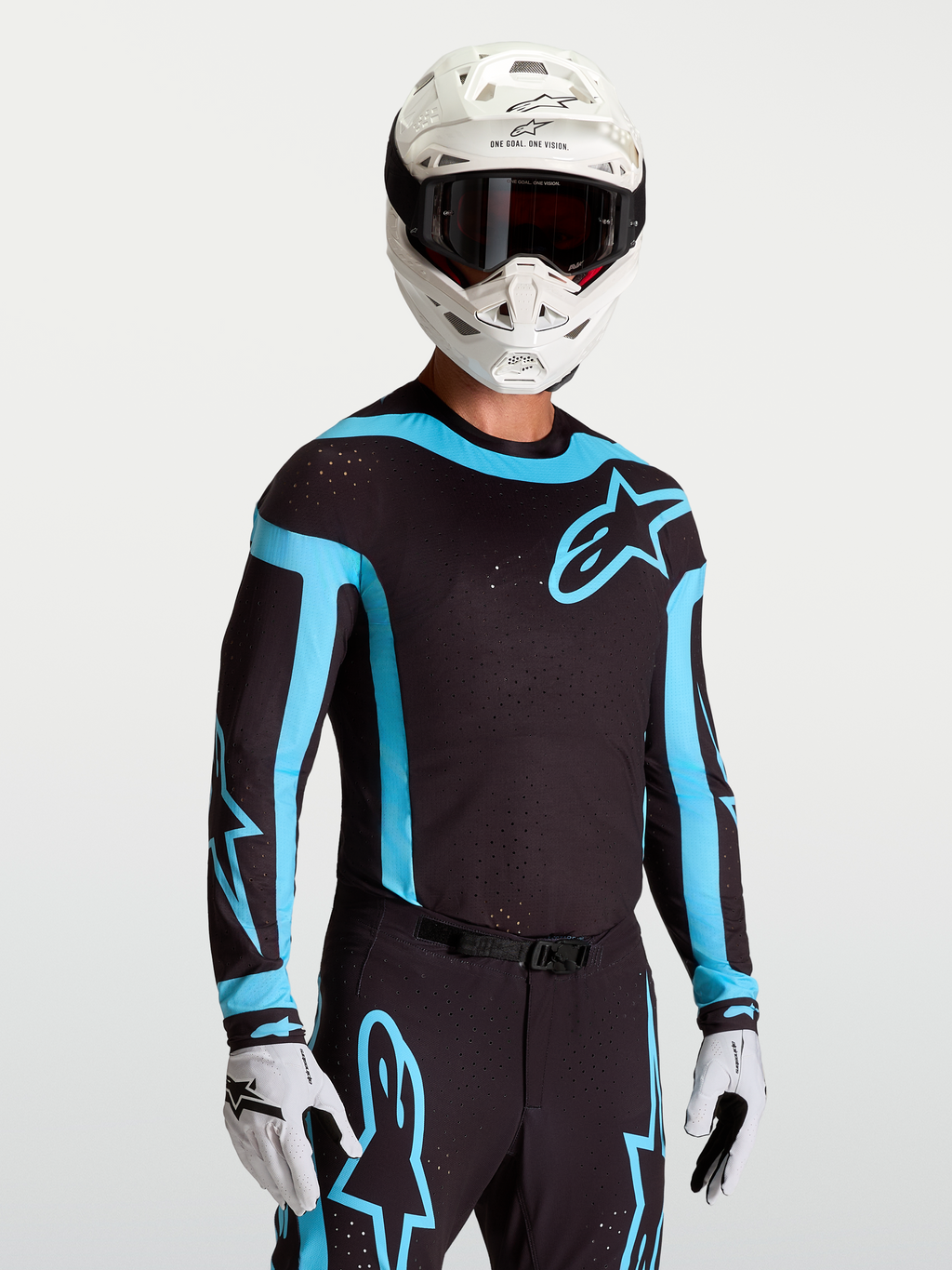 Alpinestars Supertech Vesta jersey, zwart en turkoois herenmotocrossjersey met laser-gesneden ventilatie en racepasvorm.