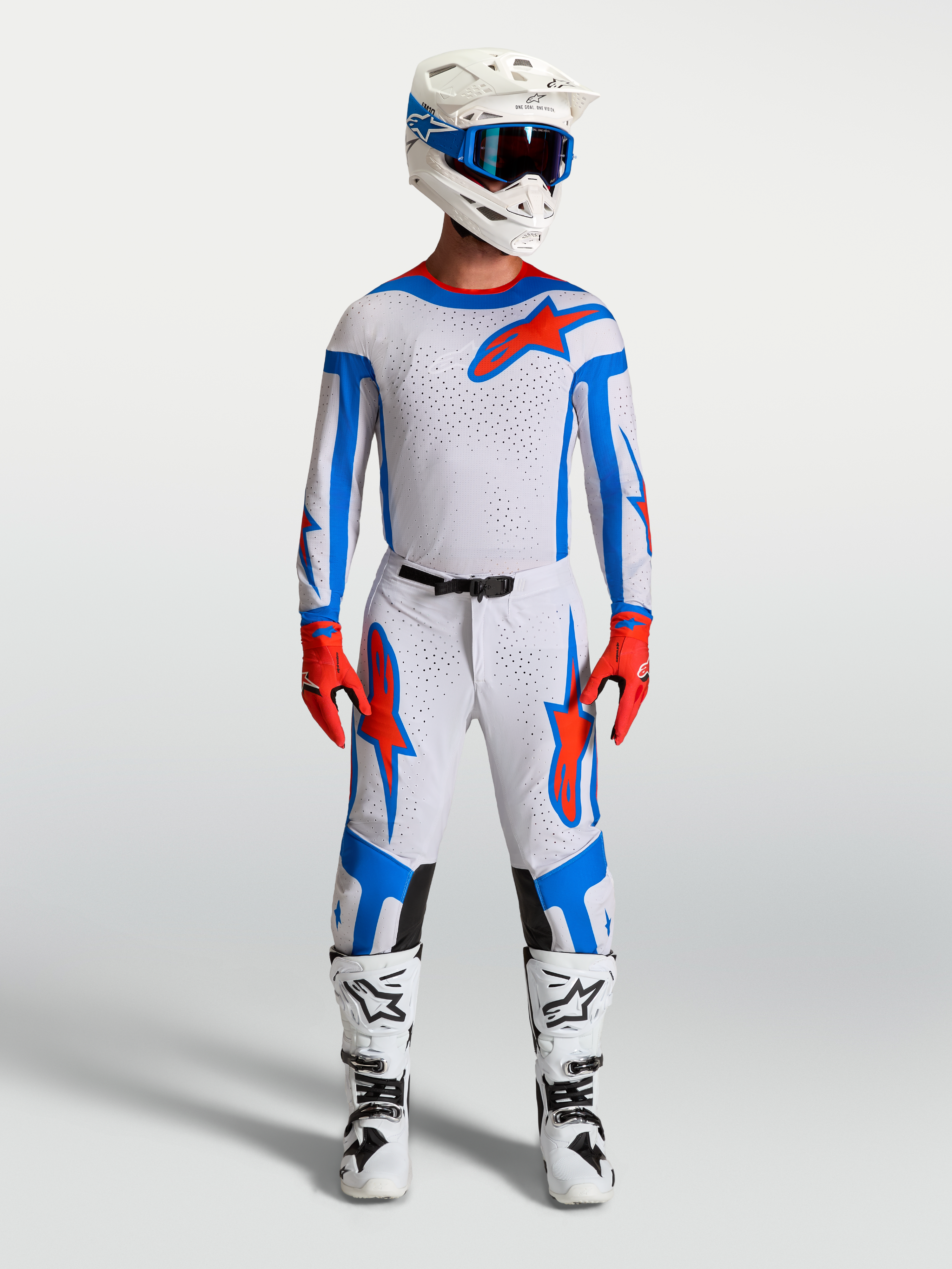 Alpinestars Supertech Vesta Trikot und Gear Set, Herren Motocross-Ausrüstung in Helllila, Blau und Kardinalrot.