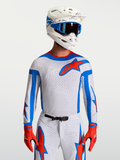 Maillot Supertech Vesta Alpinestars, haut de motocross lilas et rouge, maille respirante et coupe athlétique pour homme.