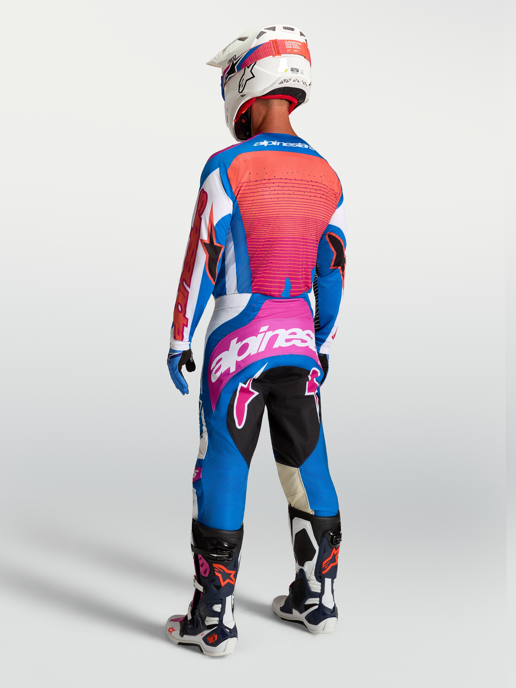 Alpinestars Techstar Maven jersey en uitrustingsset, blauw en koraalrood, motocrossuitrusting, achteraanzicht.