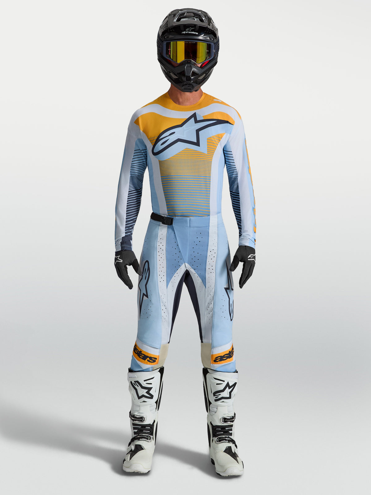 Alpinestars Maillot Techstar Maven et Gear Set, tenue de motocross homme, bleu et orange, coupe athlétique.
