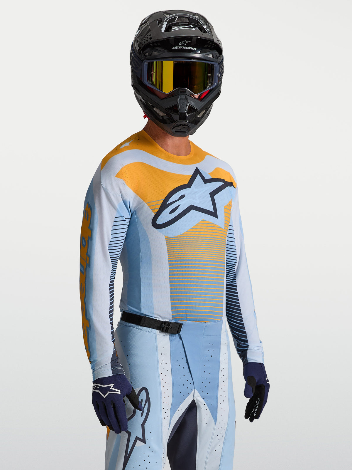 Maillot Alpinestars Techstar Maven, maillot de motocross pour homme, bleu et orange, coupe racing haute performance.