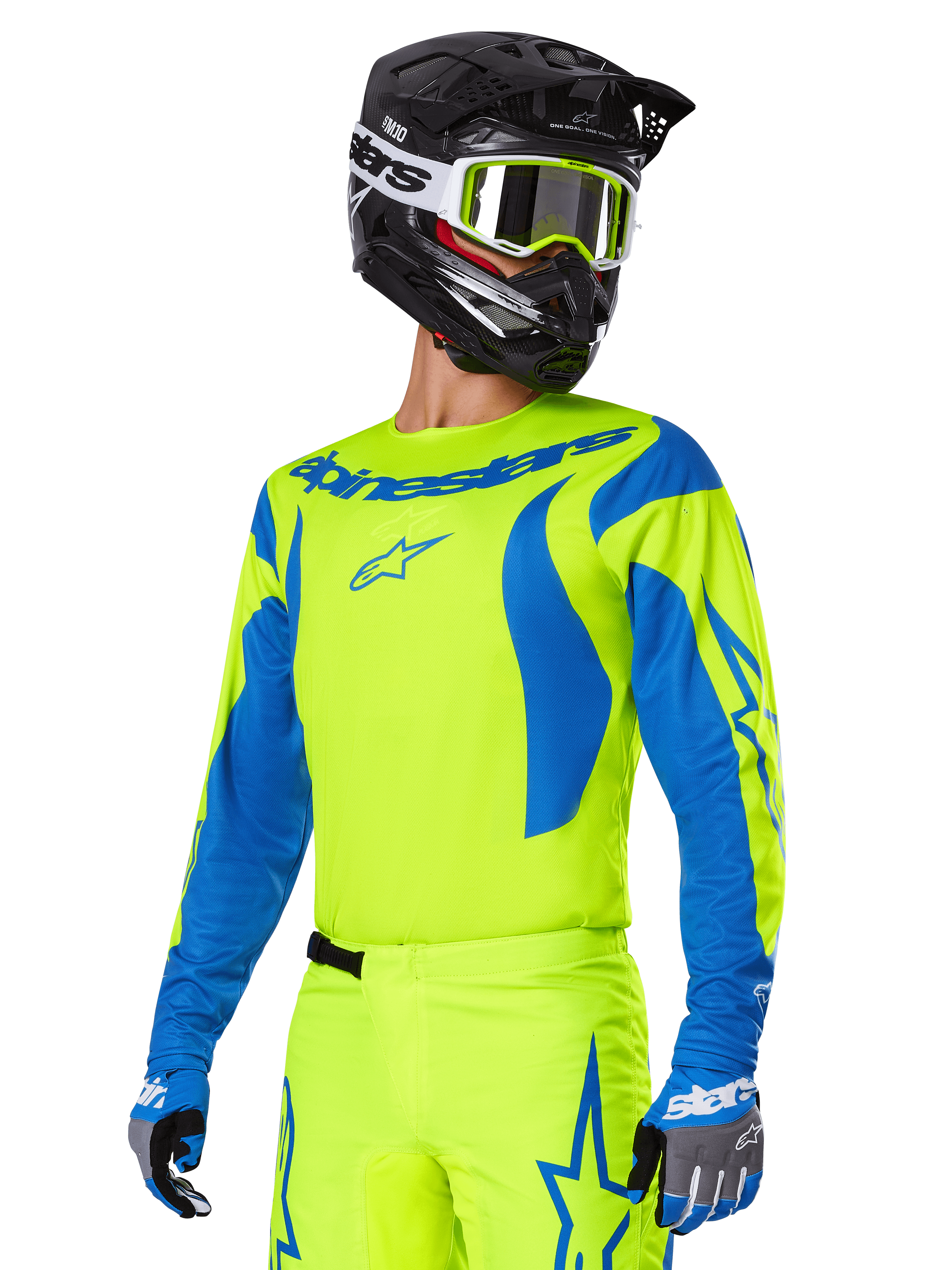 Alpinestars 2025 Fluid Haul Ausrüstungsset, Motocross-Trikot und -Hose, leuchtendes Gelb und Blau, getragen mit schwarzem Helm und gelber Crossbrille, wellenartige blaue Muster an den Ärmeln und blaue Stern-Logos auf der Hose, abgestimmtes Offroad-Rennoutfit