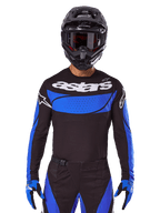Alpinestars Techstar Dreem Jersey AND Gear Set, maillot de motocross noir et bleu pour homme, porté par un pilote