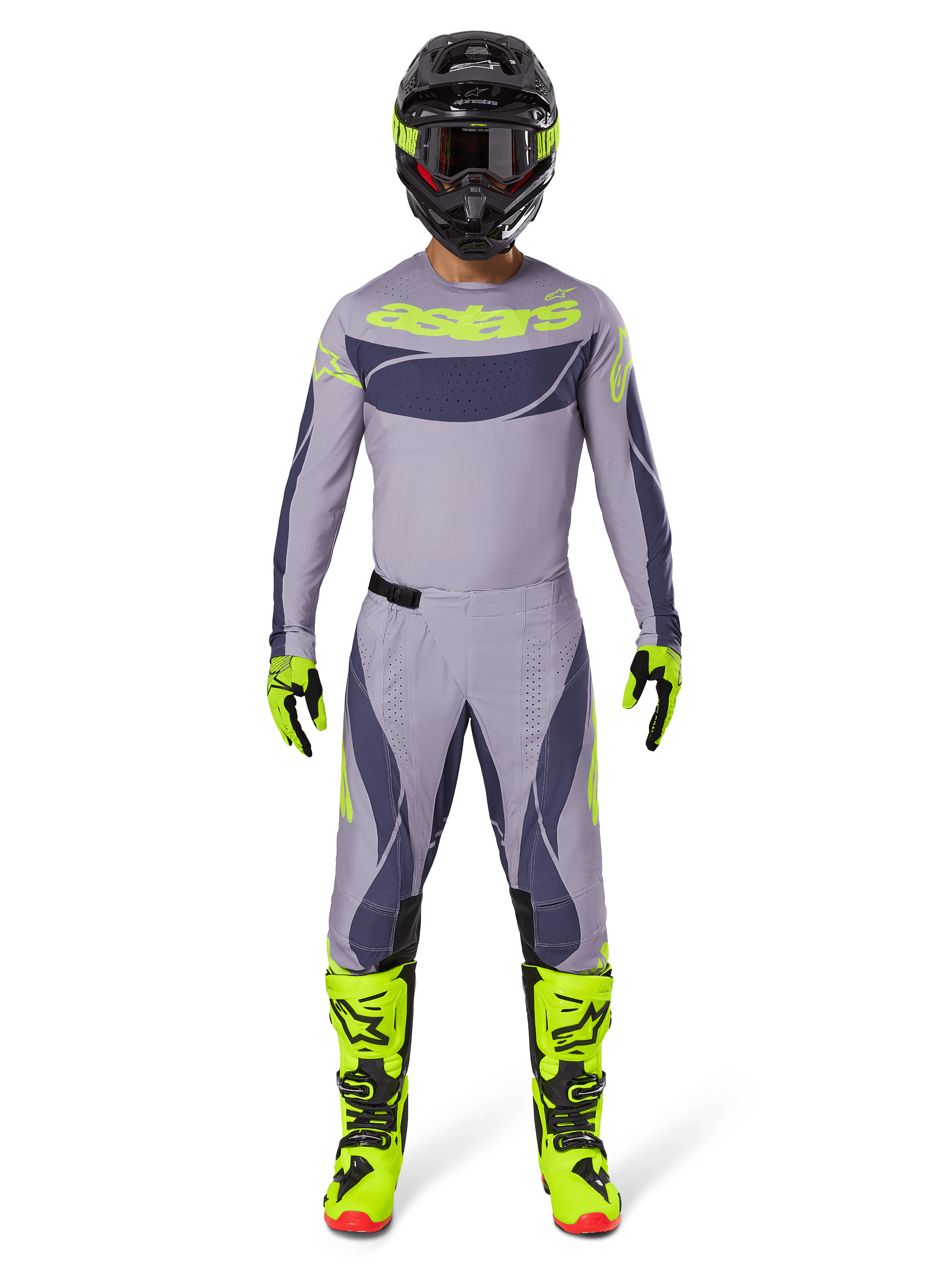 Motocross-Fahrer im Alpinestars 2025 Techstar Dreem Gear Set in Grau und Dunkelgrau mit auffälligen neongelben Akzenten, komplett mit passendem Trikot, Hose, neongelben Stiefeln und einem schwarzen Helm, entwickelt für den professionellen Offroad-Rennsport.