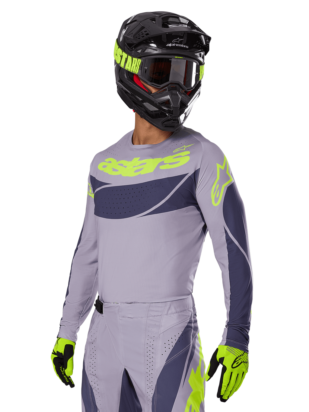 Motocross-Fahrer mit Alpinestars 2025 Techstar Dreem Jersey, Grau und Dunkelgrau mit limonengrünen Logos, passender Hose, schwarzem Helm mit limonengrünen Akzenten, limonengrün-schwarzen Handschuhen, abgestimmtes Outfit für den Offroad-Rennsport