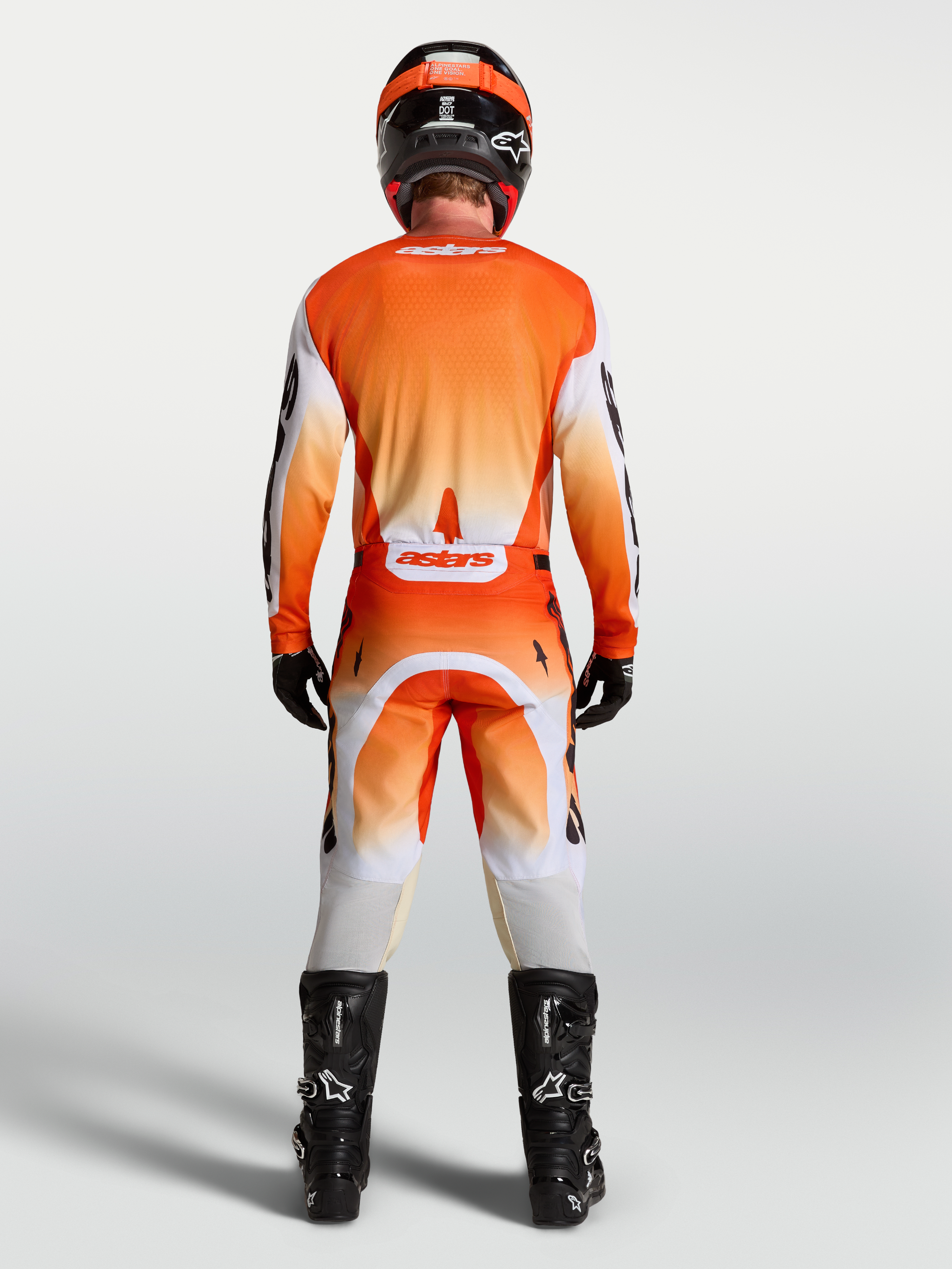 Alpinestars Racer Amber broek en uitrustingsset, heren-motorcrossoutfit, oranje en wit, achteraanzicht.