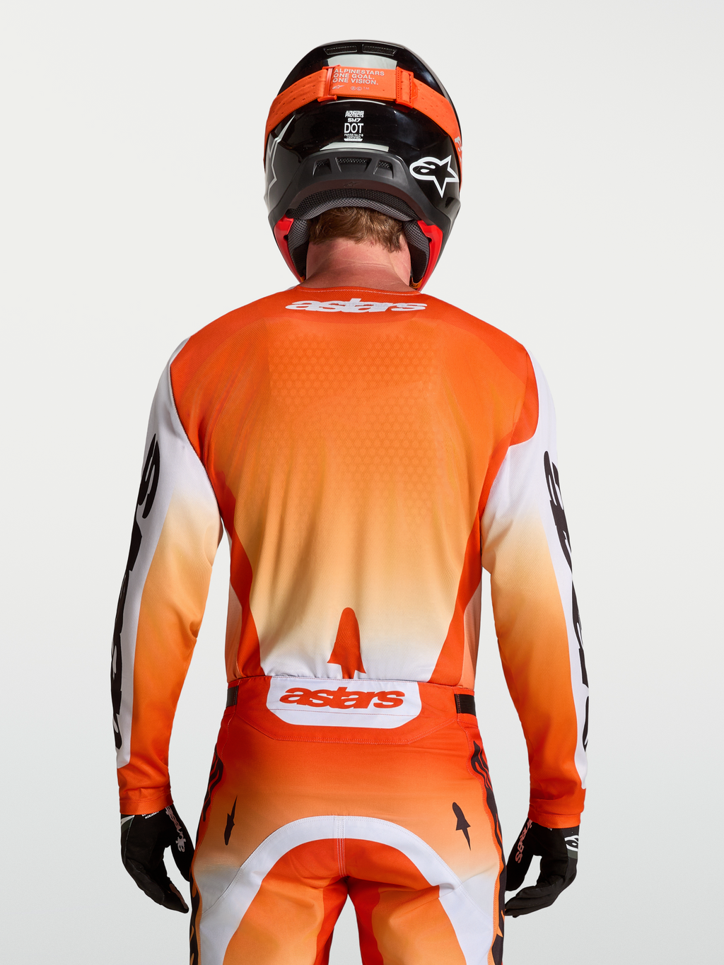 Alpinestars Racer Amber Trikot, Motocross-Trikot für Herren, Rückansicht, Orange und Weiß, feuchtigkeitsableitendes Material.
