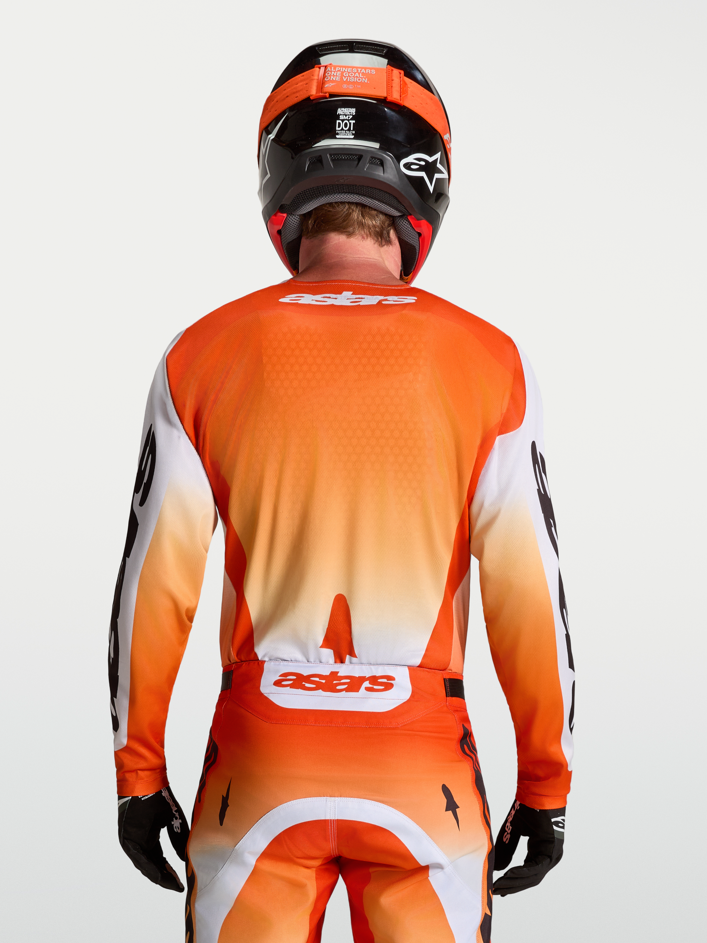 Alpinestars Racer Amber Trikot, Motocross-Trikot für Herren, Rückansicht, Orange und Weiß, feuchtigkeitsableitendes Material.
