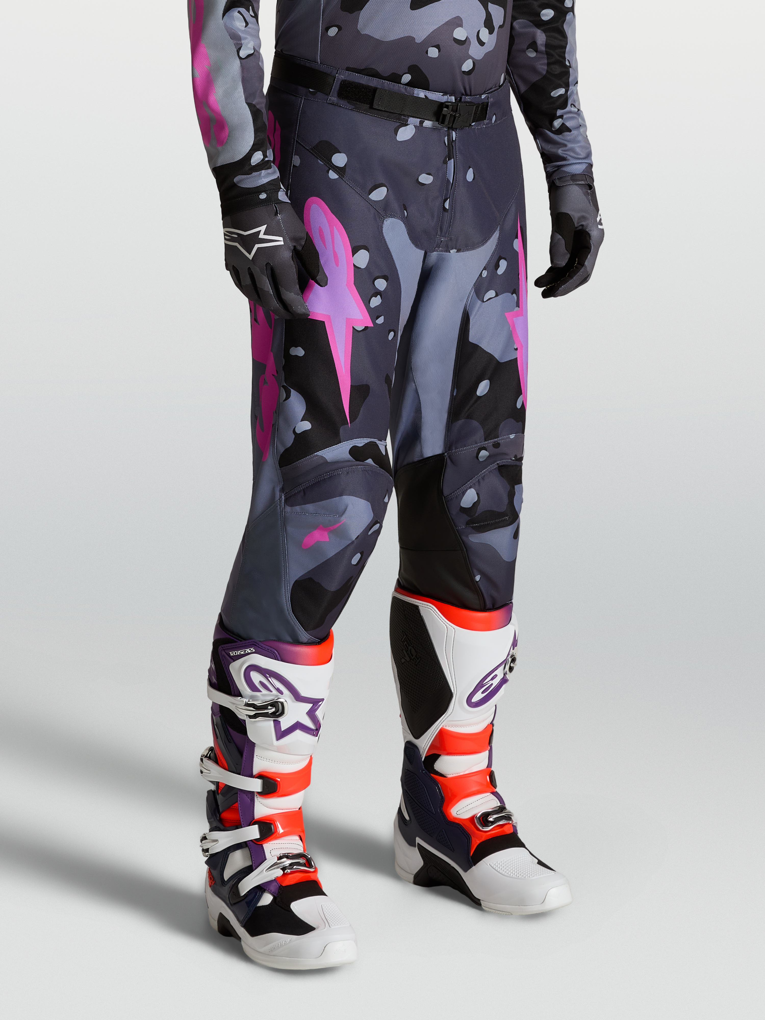 Alpinestars Racer Lone Pants, Gray Camo and Purple Motocross Pants for men, featuring a pre-curved race fit, 600D polyfabric, leather inner knee panels, and ergonomic stretch inserts for off-road performance.