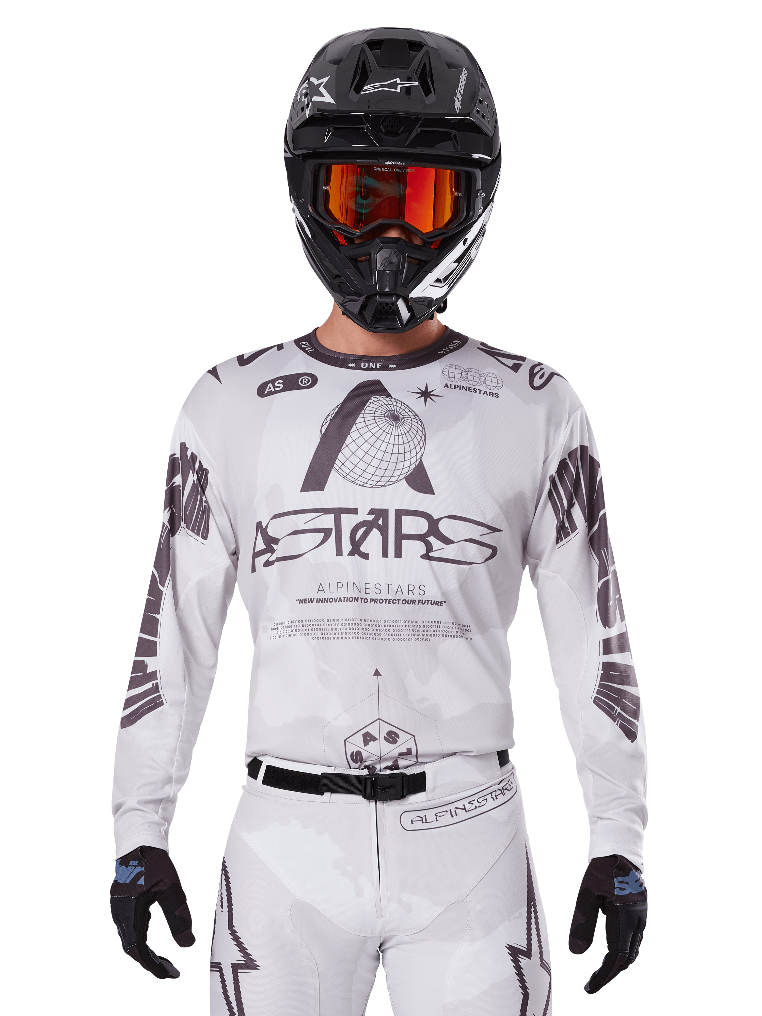 Alpinestars 2025 Racer Hollow Jersey, Motocross Jersey, White and Black, worn with matching white MX pants and a black helmet with orange goggles, featuring bold Alpinestars branding and globe graphics, professional off-road racing gear