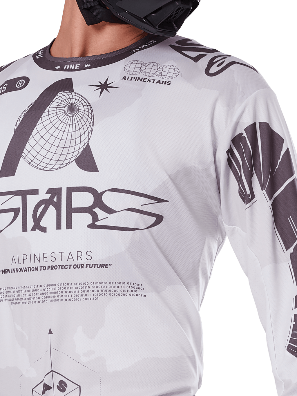 Close-up of Alpinestars 2025 Racer Hollow Jersey, White and Grey, featuring black graphic prints with globe logo and binary code, technical motocross apparel for off-road riding