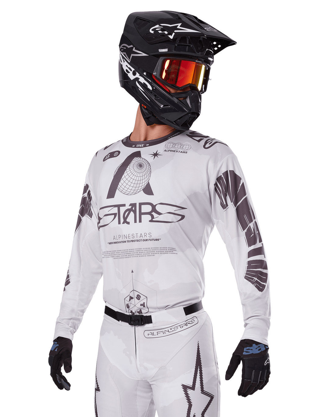 Alpinestars 2025 Racer Hollow Gear Set, Motocross Jersey and Pants, White with black and grey graphics, featuring 'ASTARS' branding and hollow globe designs, worn with a black helmet, red mirrored goggles, and black gloves, designed for off-road performance