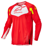 Alpinestars Techstar Factory Jersey, maillot de motocross, rouge fluo avec panneau blanc sur la poitrine et accents jaune fluo, tissu en maille léger et respirant, design à manches longues pour la course tout-terrain
