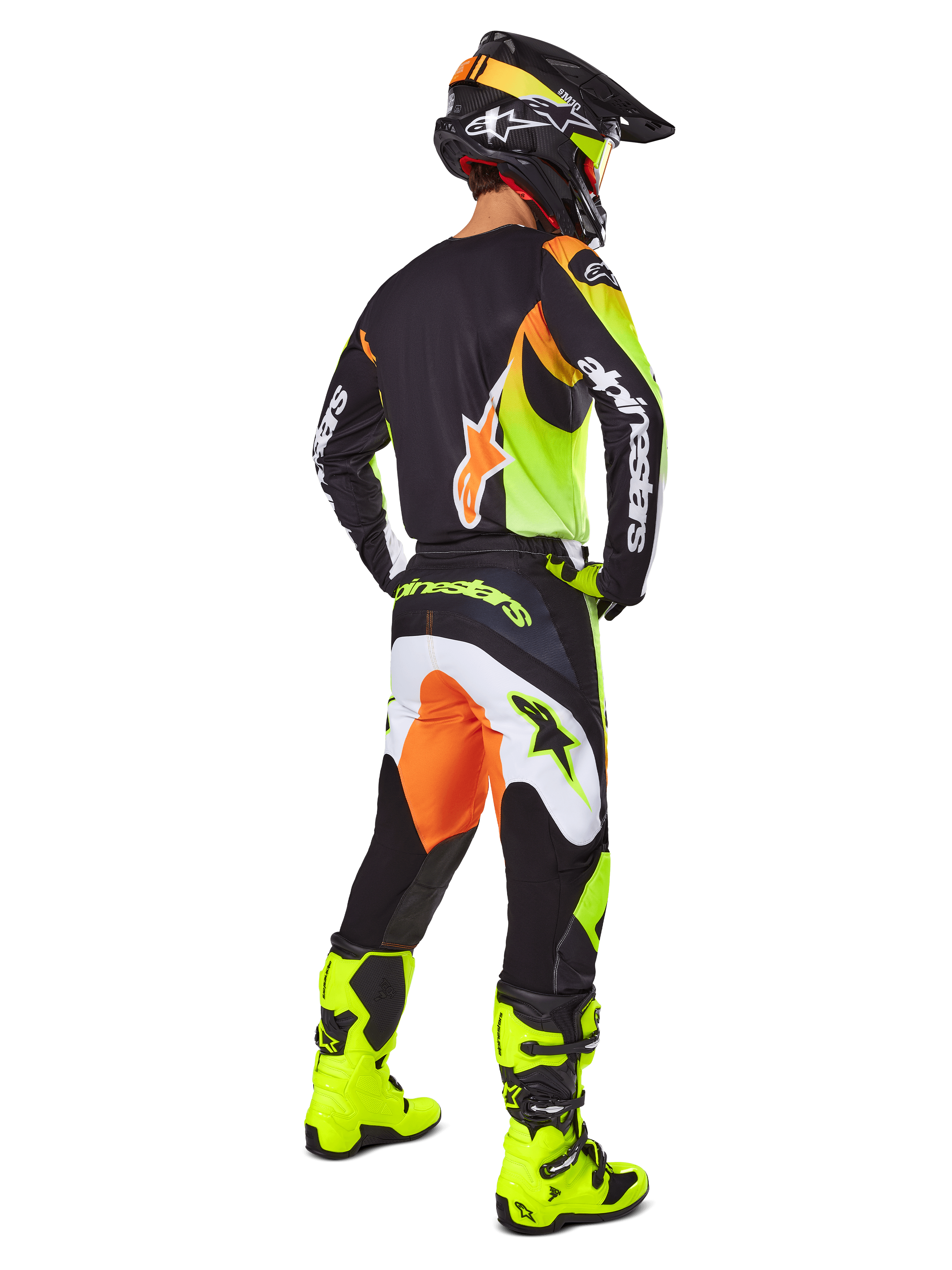 Alpinestars 2025 Fluid Wurx Gear Set, Motocross Jersey and Pants in Yellow, Black, and Orange, shown from a rear three-quarter view, paired with matching black helmet and bright yellow boots, professional off-road racing gear.