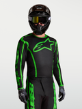 Maillot Alpinestars Fluid Apex V2, maillot de motocross pour homme, noir et vert fluo, en tissu léger évacuant l'humidité.