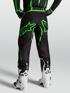 Alpinestars Fluid Apex V2 Pants, Men's Motocross and Off-Road Pants, Black and Green Fluo, Rear View on Model with White Boots.