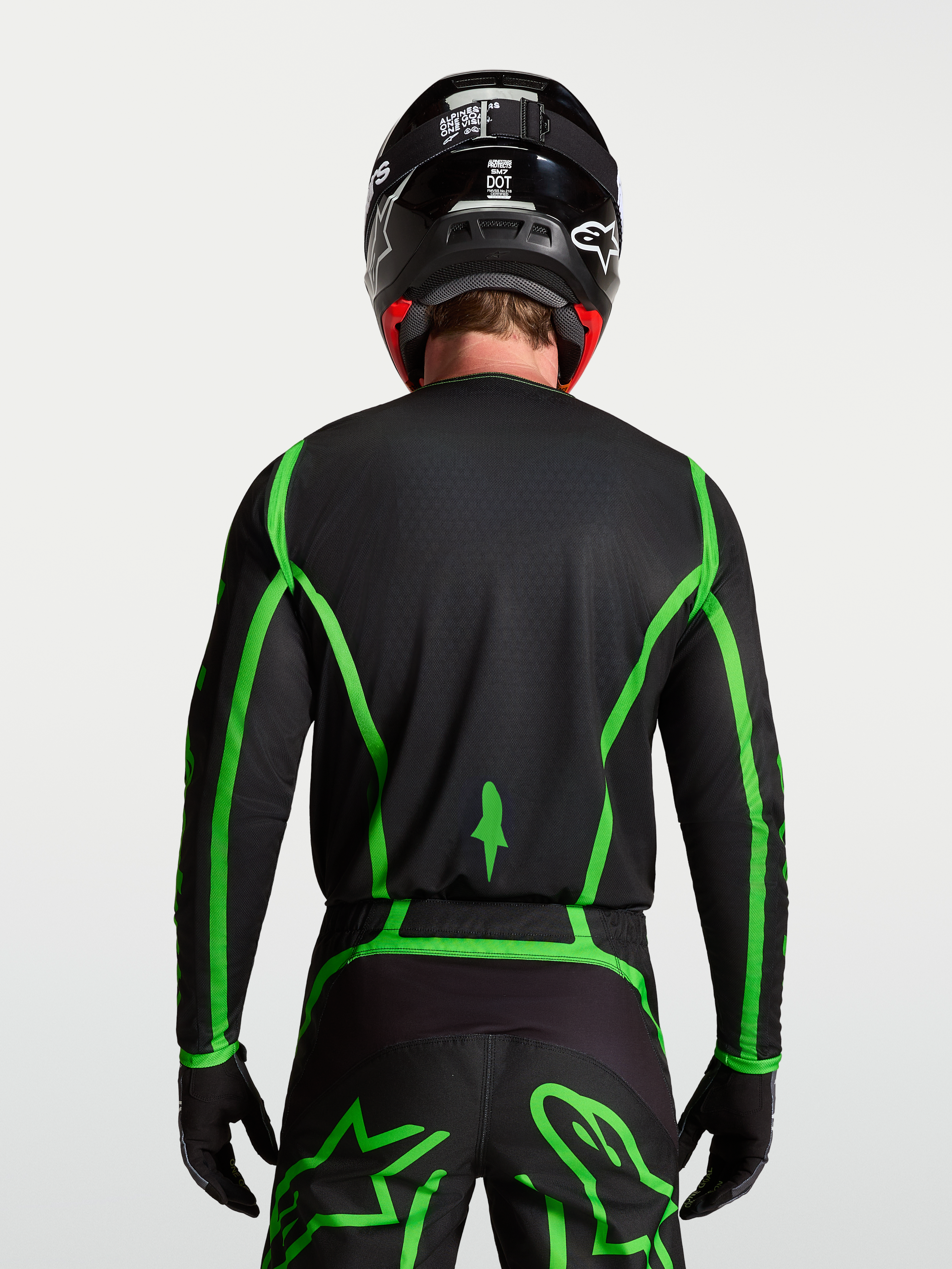 Alpinestars Fluid Apex V2 jersey, motocross, zwart en fluoriserend groen, achteraanzicht met verlengde achterzoom.
