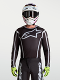 Alpinestars Fluid Apex V2 Trikot, Herren-Motocross-Trikot, Schwarz und Silber, großes Stern-Logo, sportliche Passform.