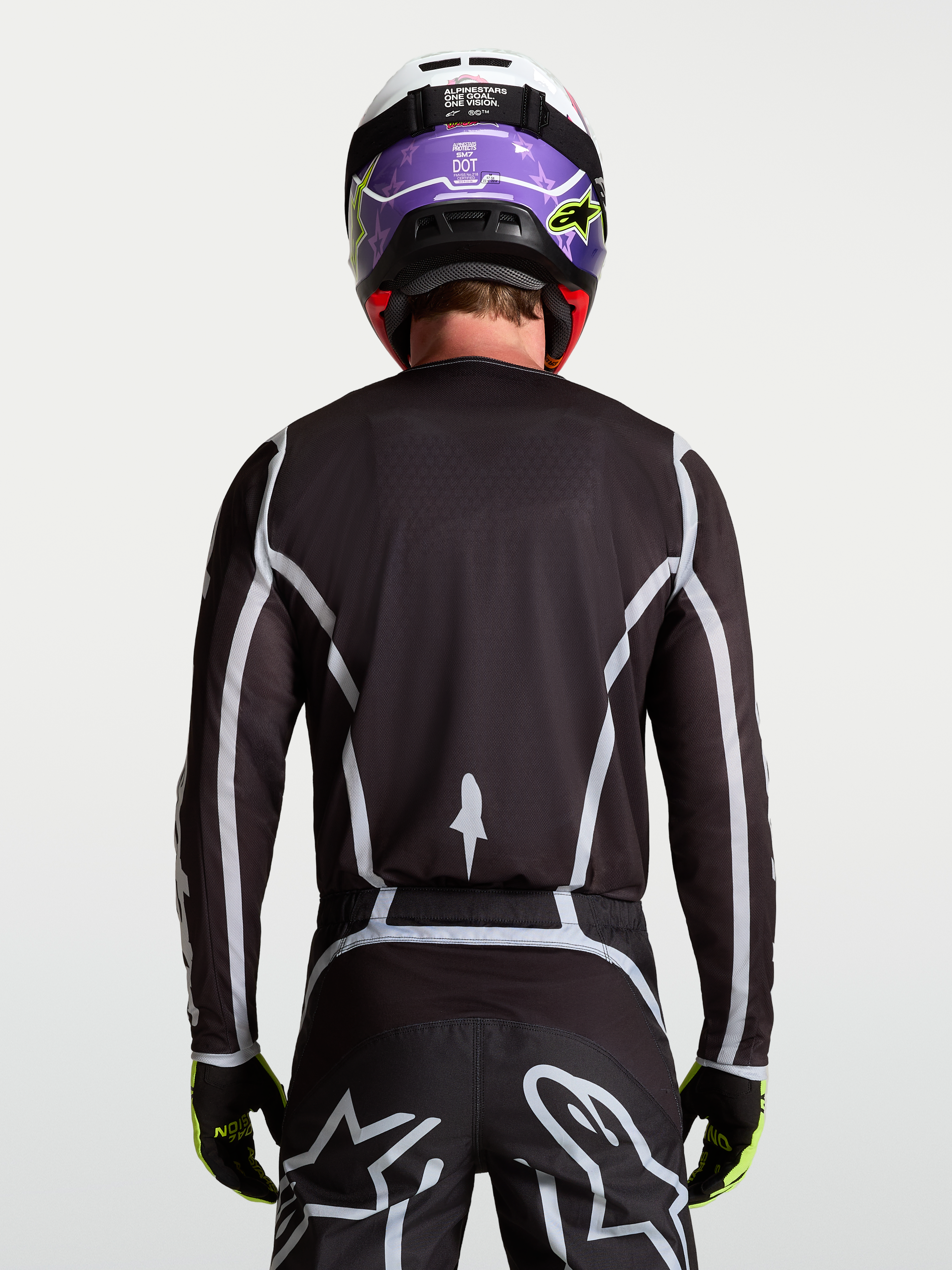 Alpinestars Fluid Apex V2 Jersey, Men's Motocross Jersey, Black and Silver, rear view on-model with ergonomic athletic fit.