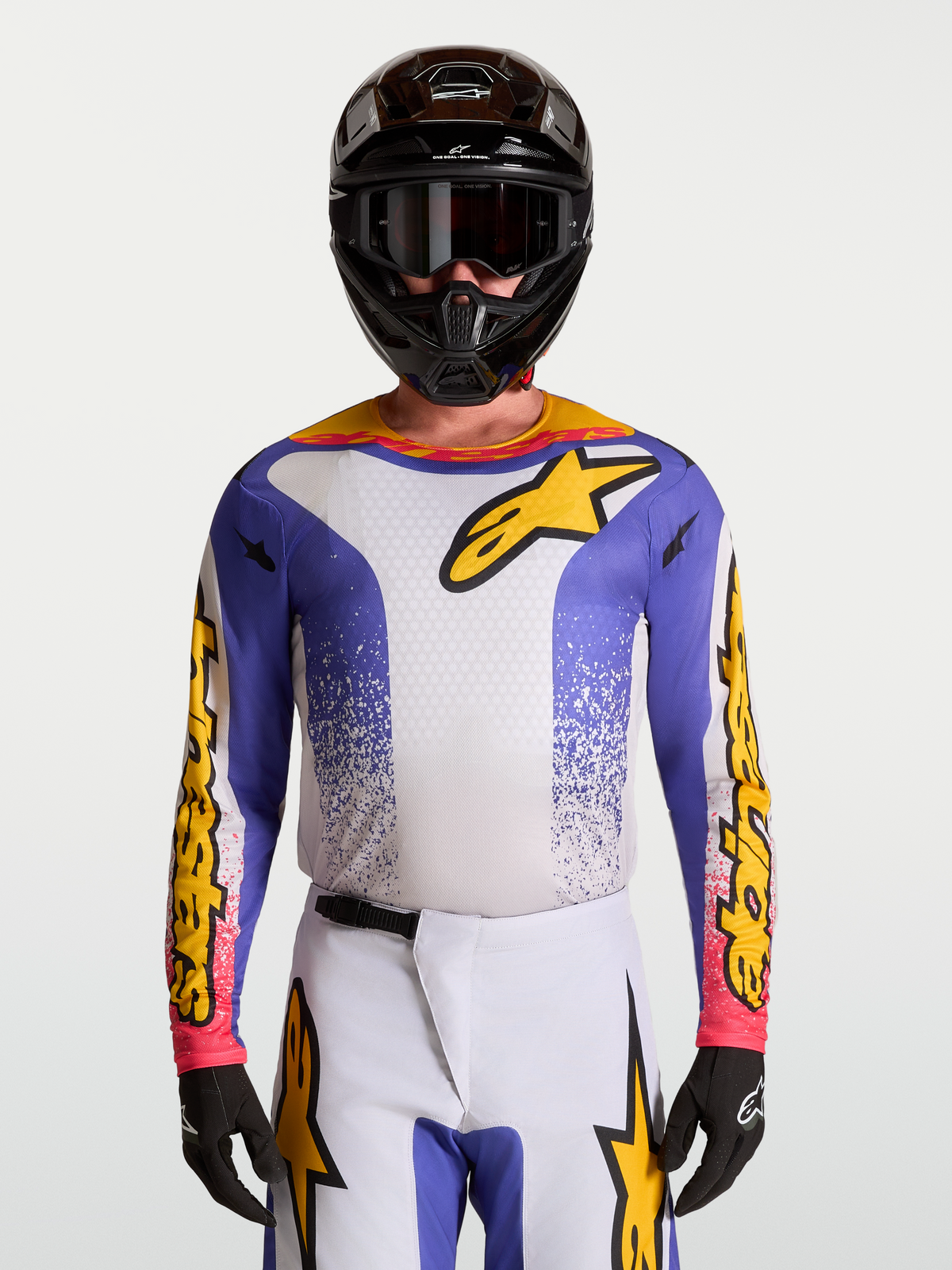 Maillot Fluid Drag d'Alpinestars, maillot de motocross pour homme, bleu iris et doré, tissu technique respirant.