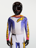 Alpinestars Fluid Drag Jersey, Men's Motocross Jersey in Blue Iris and Gold with moisture-wicking fabric.