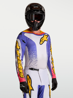 Alpinestars Fluid Drag jersey, herenmotorcrossjersey voor off-road, blauw en geel, vochtafvoerende stof, gedragen door model.