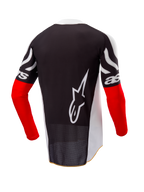 Alpinestars Limited Edition Techstar Deep Trikot, Motocross-Trikot, Rückansicht, Schwarz und Weiß mit High-Red-Ärmeln, großes weißes Alpinestars-Logo auf der Rückseite, athletische Rennpassform mit perforiertem Poly-Gewebe
